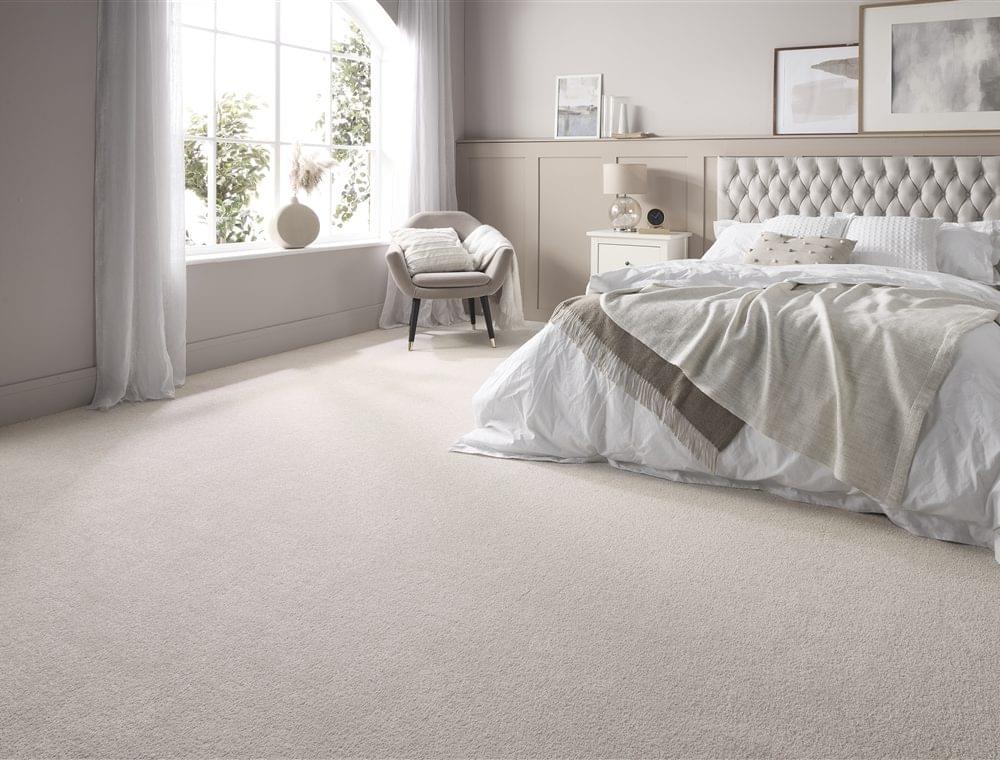 Light neutral carpet in a calm bedroom